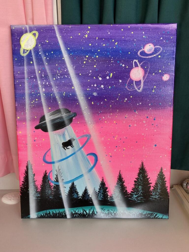 A colorful painting of a UFO beaming up a cow, surrounded by stars and planets.