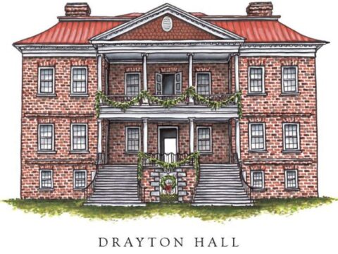Drayton Hall, a historic brick building, features festive greenery and a wreath on the front door.
